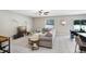 Spacious living room with ample seating, enhanced by natural light and modern decor at 4918 Wild Senna Blvd, Tampa, FL 33619