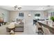 Inviting open concept with neutral tones and seamless transition to dining area at 4918 Wild Senna Blvd, Tampa, FL 33619