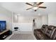 Cozy loft with ceiling fan, comfy leather love seat, television and access to additional rooms at 4918 Wild Senna Blvd, Tampa, FL 33619