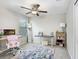 Office with ceiling fan, neutral walls, large window and desk with computer at 4918 Wild Senna Blvd, Tampa, FL 33619