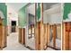 Hallway featuring tile flooring and a view into multiple rooms needing construction at 4928 Petunia Ct, New Port Richey, FL 34652