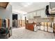 Spacious kitchen mid-renovation, features tile floors, with a view into the sunroom and bathroom at 4928 Petunia Ct, New Port Richey, FL 34652