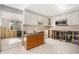Bright kitchen in need of renovation featuring tile floors, white cabinets, and stainless steel appliances at 4928 Petunia Ct, New Port Richey, FL 34652