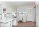 Bright home office featuring tiled floors, large windows, and ample desk space at 5111 Amulet Dr # 208, New Port Richey, FL 34652