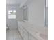 Spacious bathroom with dual sinks and a large counter with ample storage space at 5337 11Th N Ave, St Petersburg, FL 33710