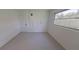 Bright bedroom with white walls and neutral carpet, featuring a window for natural light at 5337 11Th N Ave, St Petersburg, FL 33710