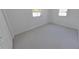 Neutral carpeted bedroom featuring a closet and bright window at 5337 11Th N Ave, St Petersburg, FL 33710
