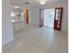 Open dining area with tile floors, views into the kitchen, and decorative wood french doors at 5337 11Th N Ave, St Petersburg, FL 33710