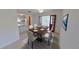 Dining room featuring an elegant table setting, tiled flooring, and double doors to another living space at 5337 11Th N Ave, St Petersburg, FL 33710