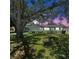 Charming single-story home featuring a well-maintained lawn, mature shade trees, and an attached garage at 5337 11Th N Ave, St Petersburg, FL 33710