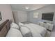 Main bedroom features a large bed and attached wall mounted entertainment center at 5337 11Th N Ave, St Petersburg, FL 33710