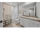 Neutral bathroom features shower-tub combo, light countertops, and a large vanity at 5813 Grand Sonata Ave, Lutz, FL 33558