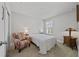Bright bedroom featuring neutral walls and carpet, along with tasteful decor and furnishings at 5813 Grand Sonata Ave, Lutz, FL 33558