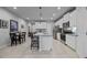 Bright kitchen with white cabinets, stainless steel appliances, a center island, and open layout at 5813 Grand Sonata Ave, Lutz, FL 33558