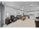 Bright living room with tile flooring, ceiling fan, and contemporary furnishings at 5813 Grand Sonata Ave, Lutz, FL 33558