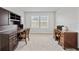 Bright home office space filled with vintage furniture and decor alongside light carpeting at 5813 Grand Sonata Ave, Lutz, FL 33558