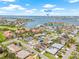 Picturesque aerial view of the neighborhood with water views, sandy beaches, and a vibrant coastal atmosphere in the distance at 6400 Mockingbird S Way, St Petersburg, FL 33707