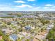 Desirable waterfront neighborhood view with a clear blue sky and lush landscaping at 6400 Mockingbird S Way, St Petersburg, FL 33707