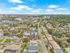 Expansive aerial view showcasing the neighborhood with a beautiful cityscape and water views in the distance at 6400 Mockingbird S Way, St Petersburg, FL 33707