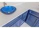 Bathroom featuring a vessel sink with a decorative blue bowl and ample countertop space at 6400 Mockingbird S Way, St Petersburg, FL 33707