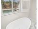 Freestanding tub with a view of the pool at 6400 Mockingbird S Way, St Petersburg, FL 33707