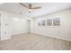 Empty bedroom with plantation shutters on the windows and a ceiling fan at 6400 Mockingbird S Way, St Petersburg, FL 33707