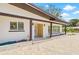 Charming front exterior showcasing the home's entrance with decorative columns and brick accents at 6400 Mockingbird S Way, St Petersburg, FL 33707