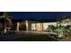 Charming single-Gathering home featuring a paver driveway and meticulously manicured front yard with professional lighting at 6400 Mockingbird S Way, St Petersburg, FL 33707
