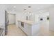 Bright kitchen with large island, stainless steel appliances, and stone countertops at 6400 Mockingbird S Way, St Petersburg, FL 33707