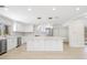 Bright white kitchen featuring stainless steel appliances and marble countertops at 6400 Mockingbird S Way, St Petersburg, FL 33707