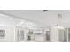 Open floor plan showing the living room, kitchen, wet bar, and dining area at 6400 Mockingbird S Way, St Petersburg, FL 33707