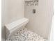 Tiled shower featuring a built-in bench and decorative niche at 6400 Mockingbird S Way, St Petersburg, FL 33707