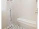 Walk-in shower with vertical tiling, a built in bench, and mosaic tile floor at 6400 Mockingbird S Way, St Petersburg, FL 33707