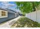 The backyard has a well manicured lawn and nice pathway at 6401 N Central Ave, Tampa, FL 33604