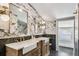 Stylish bathroom featuring marble accents, dual vanities, and modern lighting at 6401 N Central Ave, Tampa, FL 33604