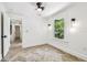 Bright room showcases wood floors, a window with a view, and modern ceiling fan at 6401 N Central Ave, Tampa, FL 33604