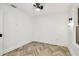 A beautifully designed bedroom featuring updated herringbone floors and modern lighting fixtures at 6401 N Central Ave, Tampa, FL 33604