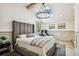 Bright bedroom showcases high ceilings, a modern chandelier, and a large comfortable bed with stylish decor at 6401 N Central Ave, Tampa, FL 33604