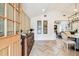 Elegant entryway with a decorative cabinet and view to the dining room at 6401 N Central Ave, Tampa, FL 33604