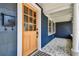 Inviting front door with wood accents and modern design details at 6401 N Central Ave, Tampa, FL 33604