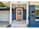 Inviting front entrance with a wood door and brick-paved steps at 6401 N Central Ave, Tampa, FL 33604