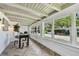 Bright hallway boasts herringbone floors, coffered ceilings, many windows and natural light at 6401 N Central Ave, Tampa, FL 33604
