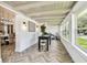 Bright hallway boasts herringbone floors, coffered ceilings, many windows and natural light at 6401 N Central Ave, Tampa, FL 33604