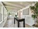 Bright hallway boasts herringbone floors, coffered ceilings, many windows and natural light at 6401 N Central Ave, Tampa, FL 33604