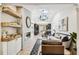 Stylish living room with hardwood floors, a fireplace, and an open floor plan into the kitchen at 6401 N Central Ave, Tampa, FL 33604