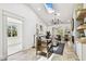 Stylish living room with hardwood floors, a fireplace, and an open floor plan into the kitchen at 6401 N Central Ave, Tampa, FL 33604