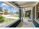 Charming covered porch with brick-paved floors and serene neighborhood views at 6401 N Central Ave, Tampa, FL 33604