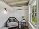 Cozy sitting area with a comfortable armchair, stylish decor, and lots of natural light at 6401 N Central Ave, Tampa, FL 33604