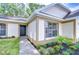 Front Entrance showcasing the front door, landscaping, and walkway to the home at 6720 Gilda Dr, Tampa, FL 33625