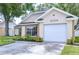 Charming single-Gathering home featuring an attached garage and well-maintained landscaping at 6720 Gilda Dr, Tampa, FL 33625